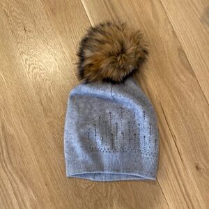 New grey with real fur Pom
Put hat